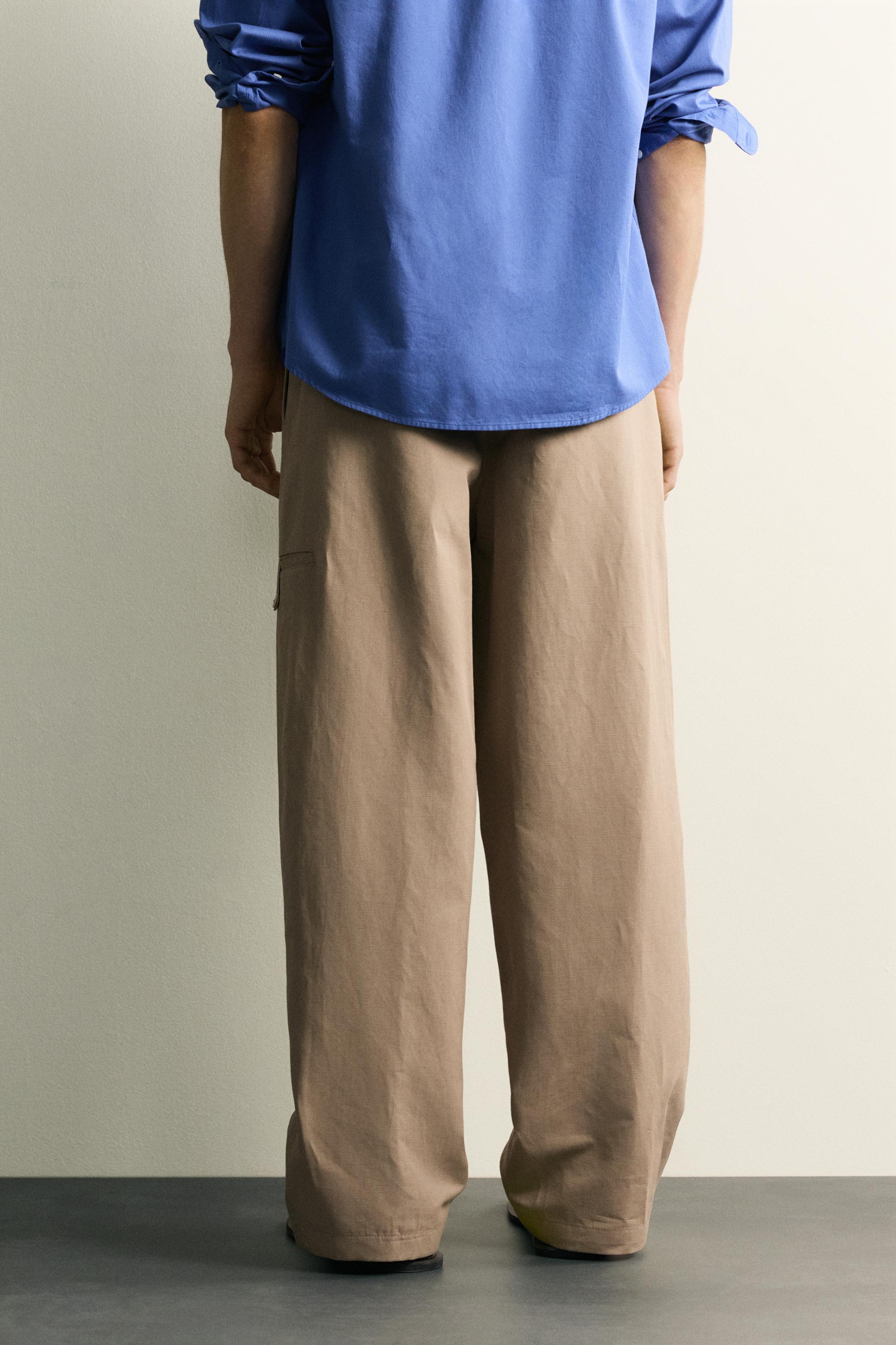 RELAXED FIT PLEATED PANTS